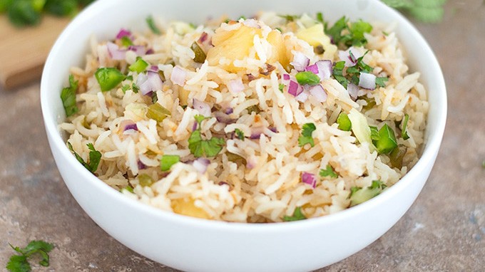 Cooked basmati rice with pineapple in a white bowl