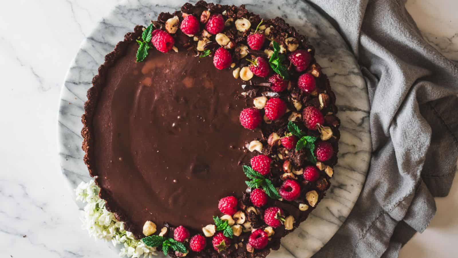 Overhead of raspberry chocolate tart.