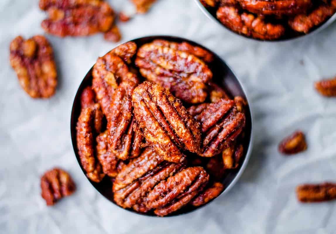 Pecans in a bowl on a table.