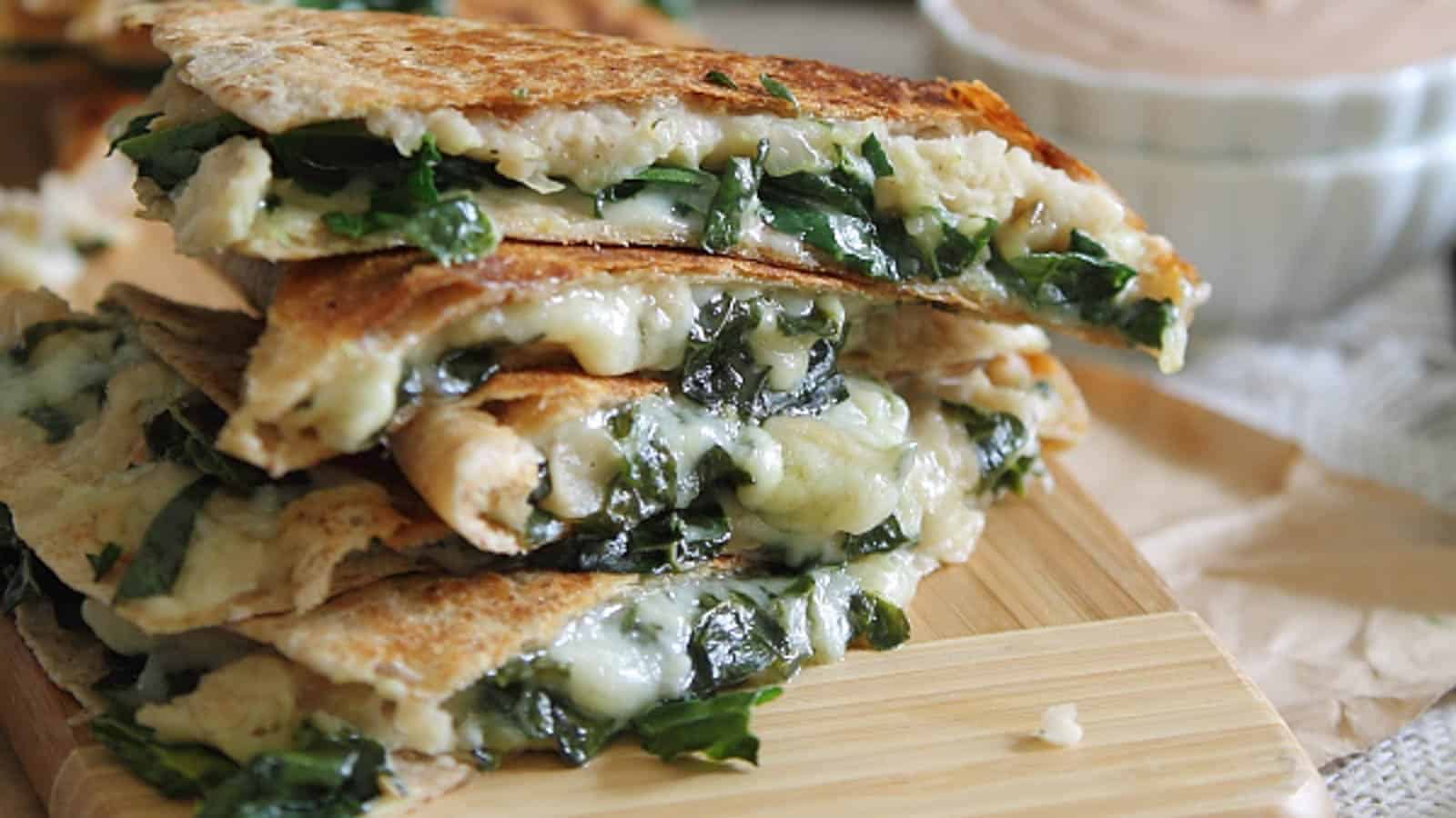 Smashed white bean quesadillas on a cutting board.