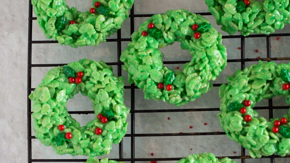 Green rice krispy treats on a cooling rack.