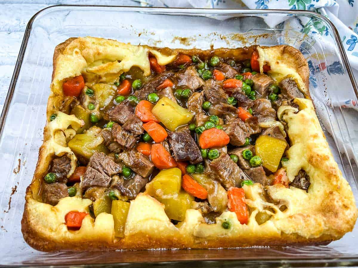 Yorkshire pudding pie in a white glass dish.