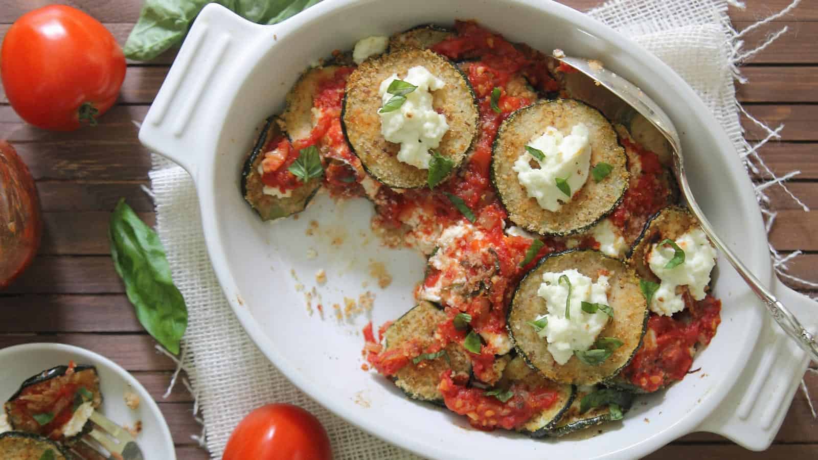 Zucchini ricotta bake in a white baking dish.