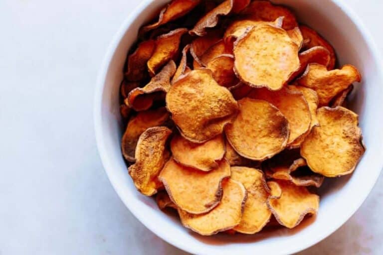 Sweet potato chips in a white bowl.