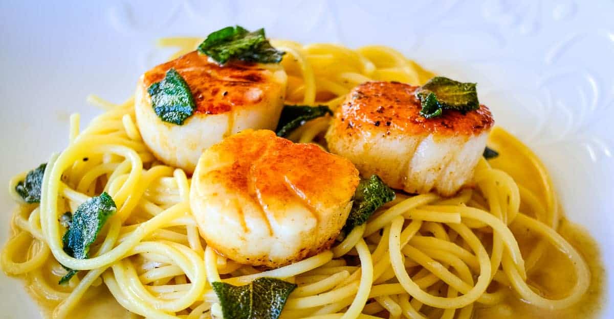 Scallops with saffron risotto.