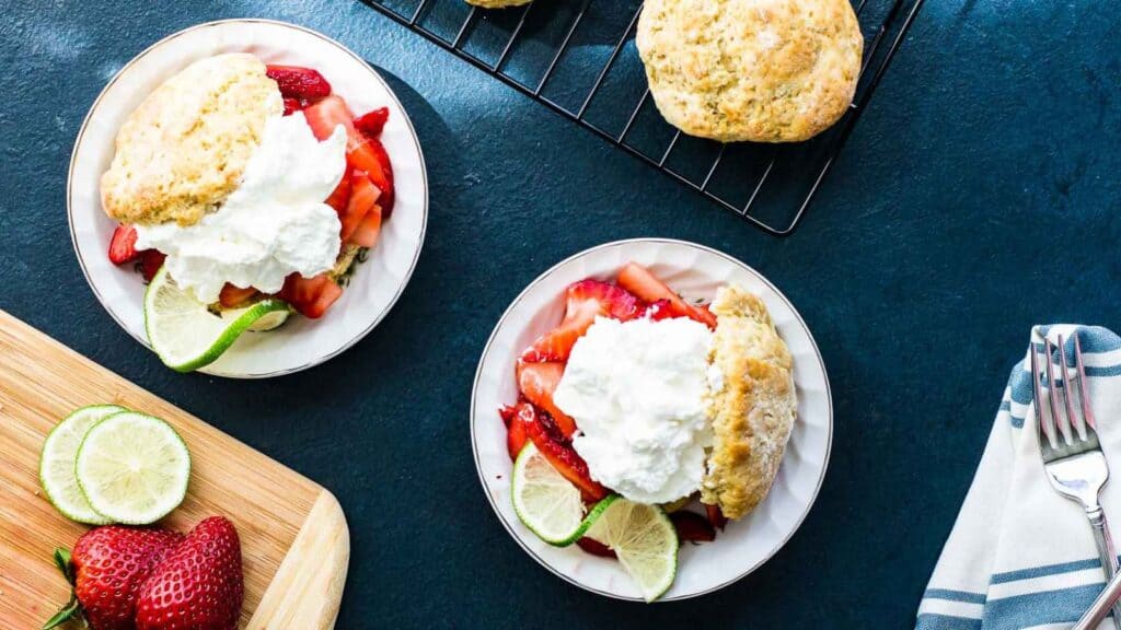 Strawberry scones with whipped cream and limes.