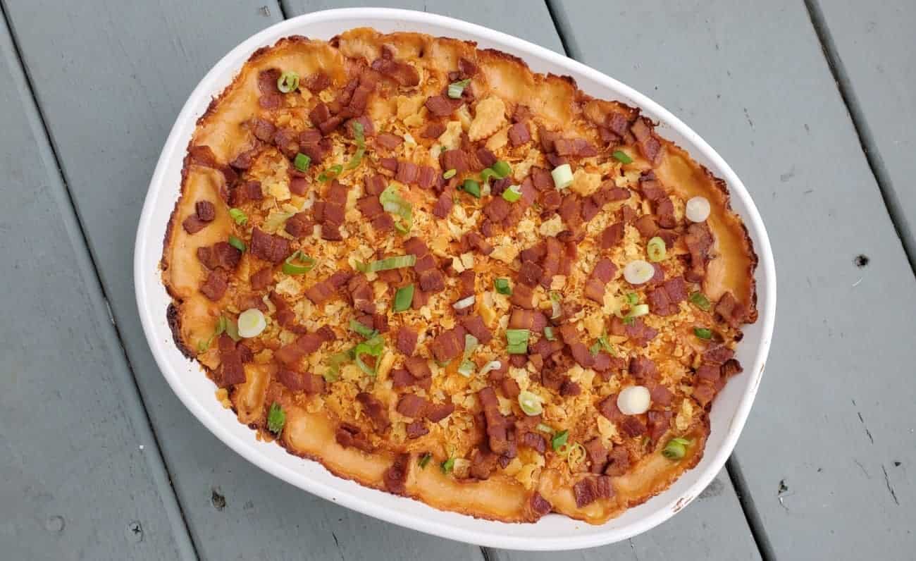 Overhead image of corn casserole in a white dish.