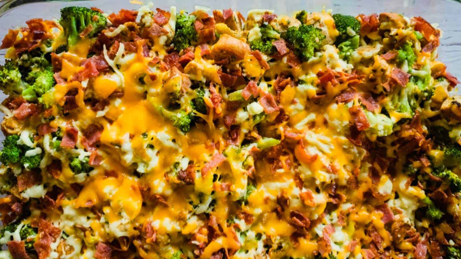 Cheesy chicken bacon ranch casserole on white wooden background.