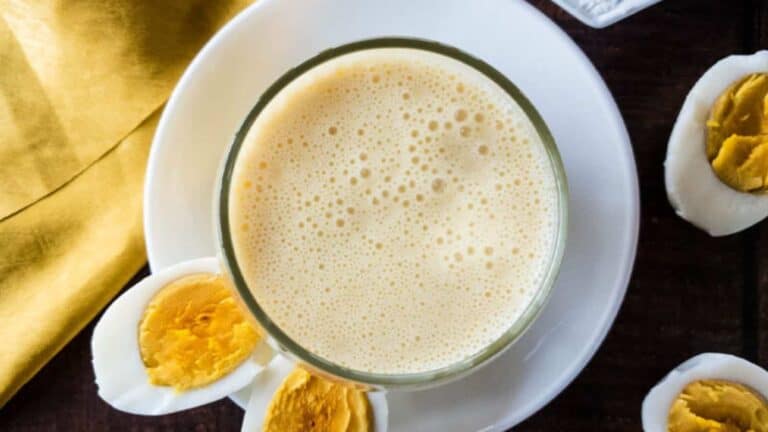 A plate with eggs and a cup of high-protein smoothie.