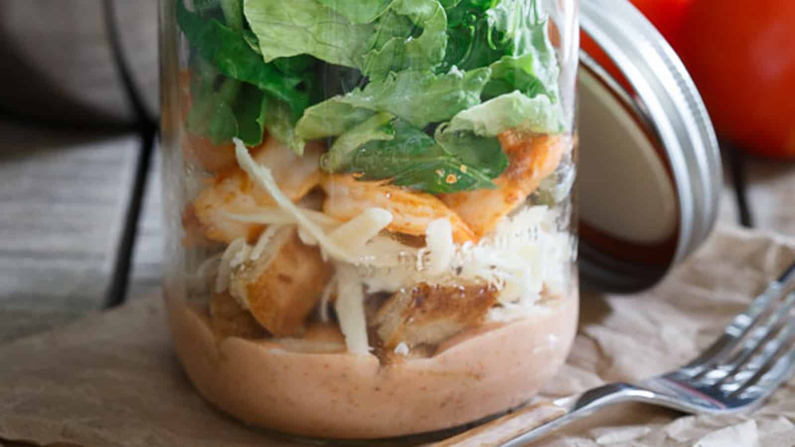 Mason jar spicy shrimp caesar salad.