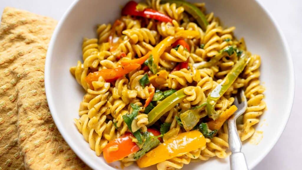 A vegan bowl of pasta with vegetables.