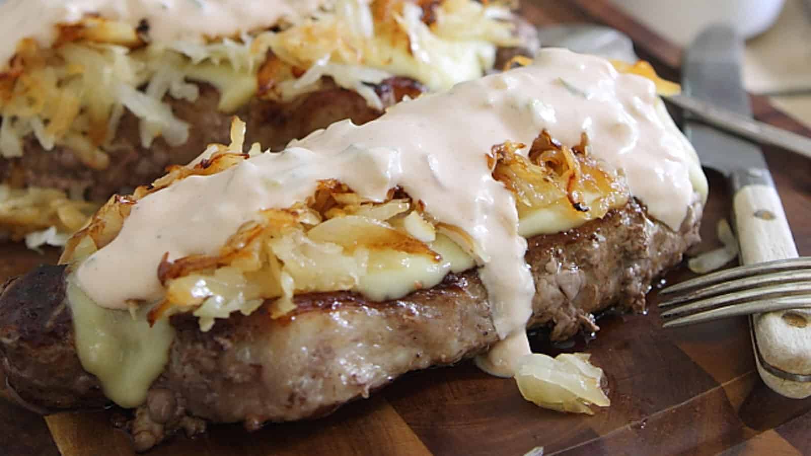 Reuben strip steaks on a cutting board.