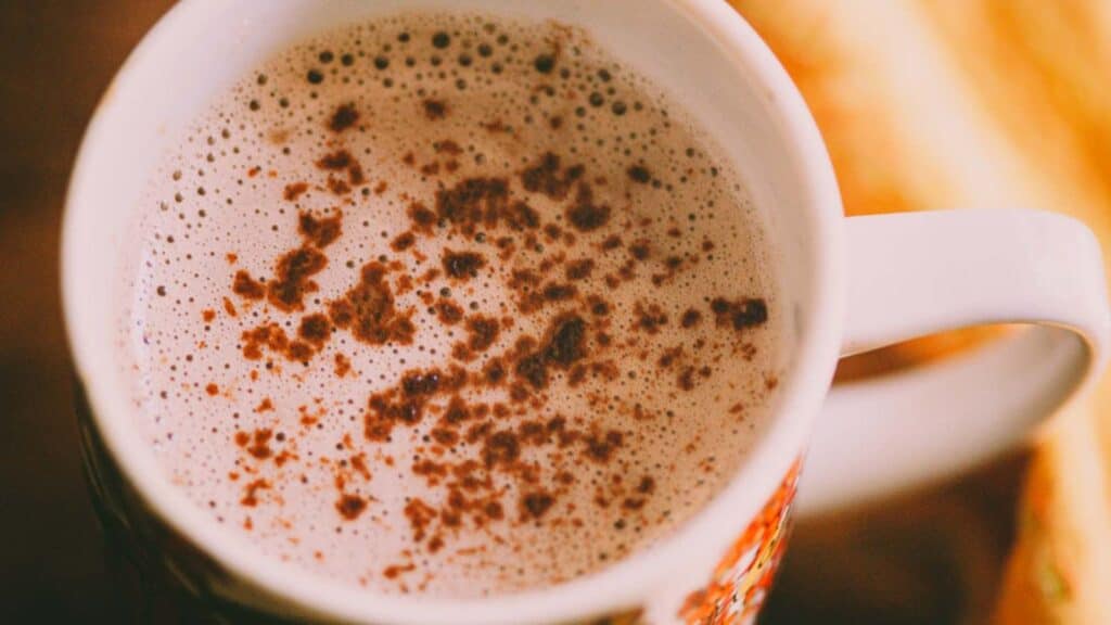 A cup of hot chocolate on a wooden table.